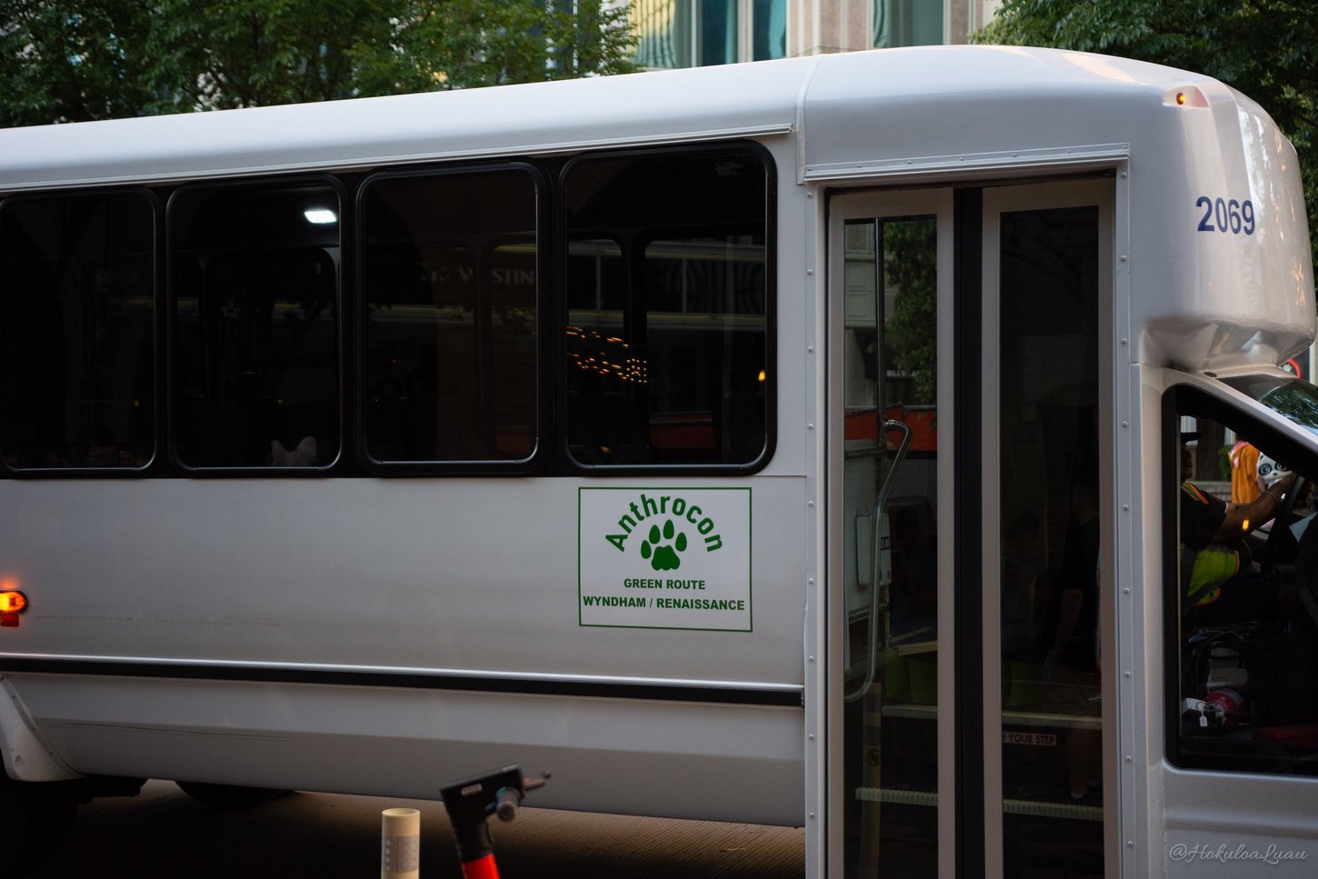 An Anthrocon shuttle bus making a stop.