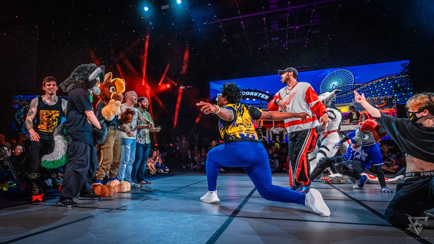 Furries and fursuiters battling each other on the floor during Floor Wars.