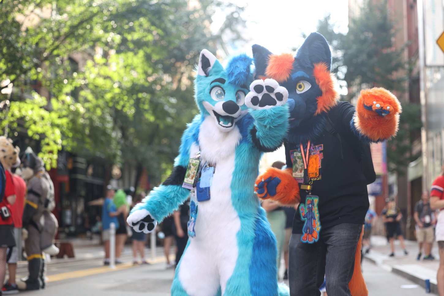 Two fursuiters on Penn Avenue walking across the street.